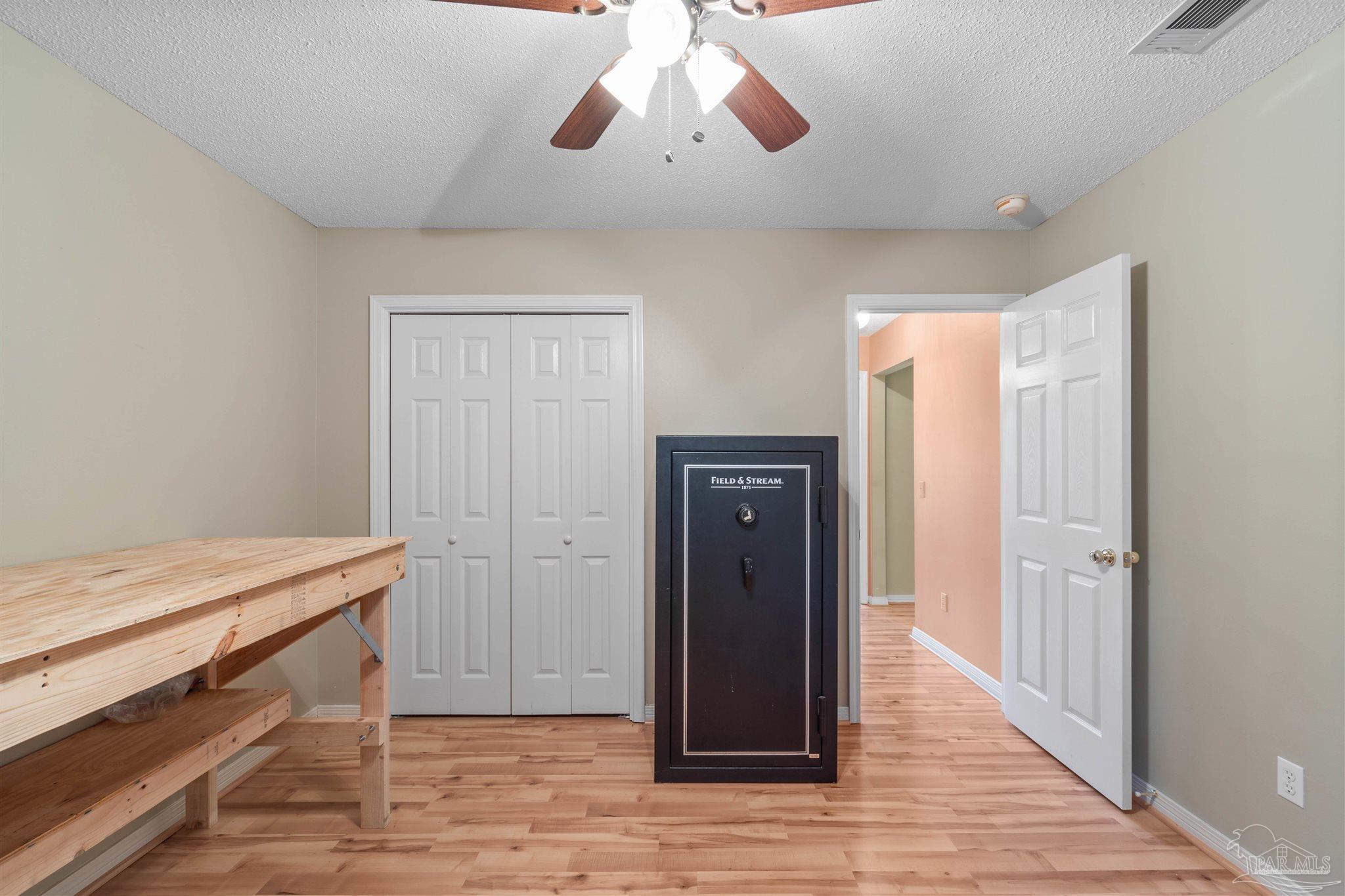 1342 Mazurek Boulevard Pensacola, FL 32514 - Photo 20 of 36 a view of a hallway with a chandelier