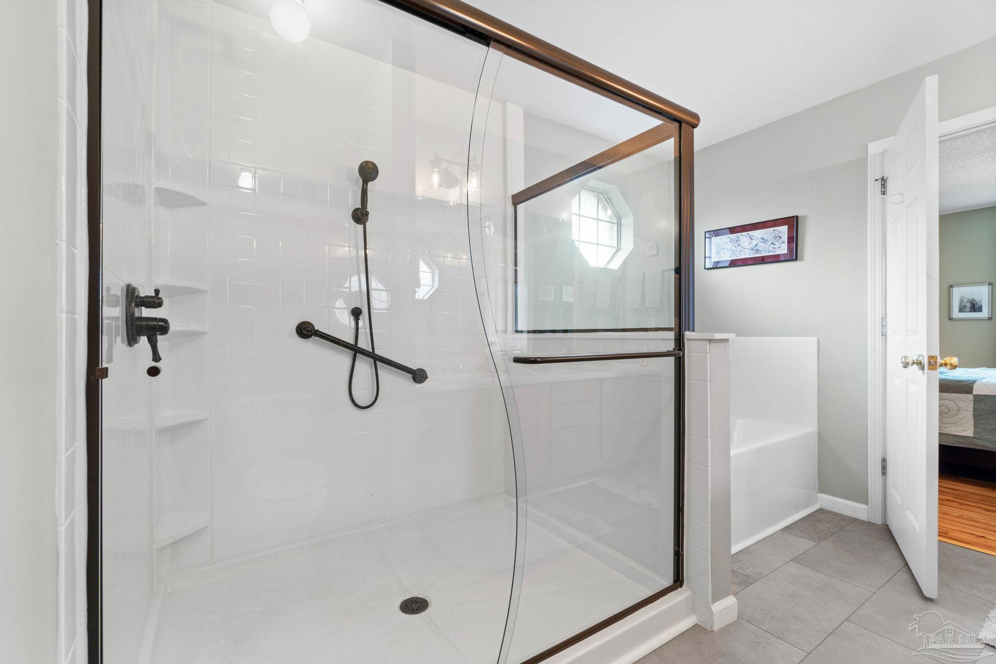 1342 Mazurek Boulevard Pensacola, FL 32514 - Photo 22 of 36 a bathroom with a glass shower door