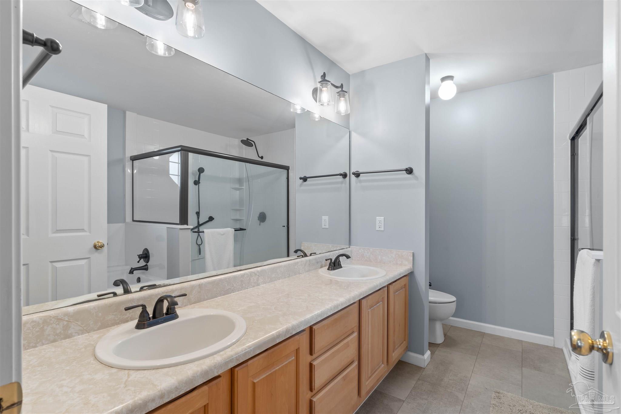 1342 Mazurek Boulevard Pensacola, FL 32514 - Photo 23 of 36 a bathroom with a sink double vanity granite tub and shower