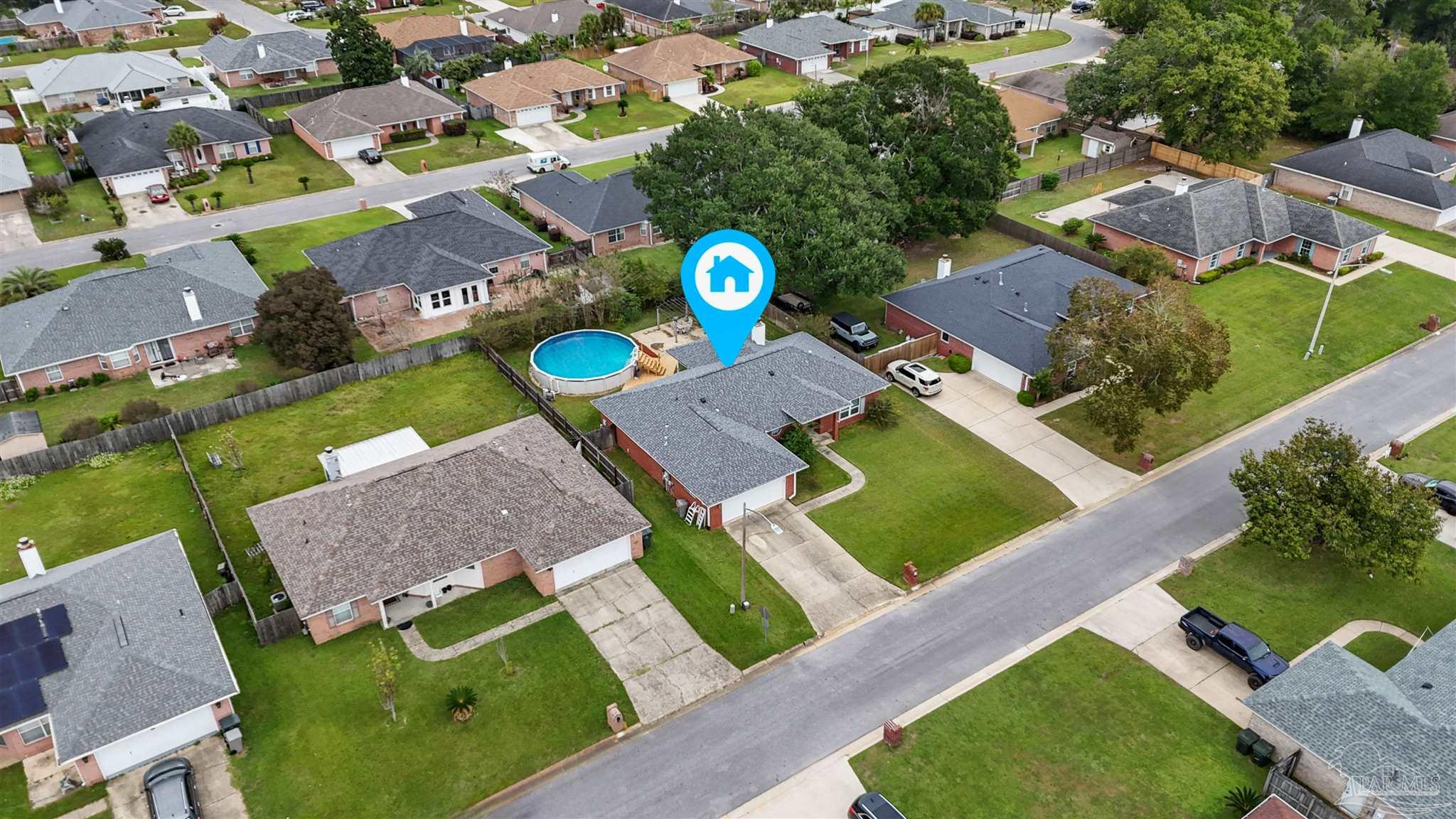 1342 Mazurek Boulevard Pensacola, FL 32514 - Photo 29 of 36 an aerial view of a house with a garden and swimming pool
