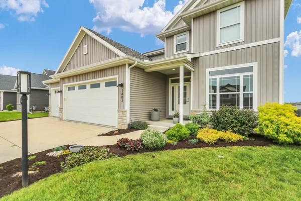 front view of a house with a yard