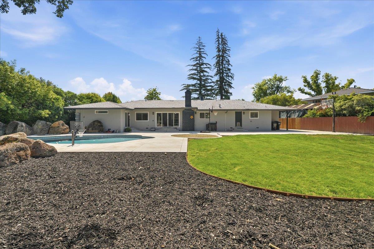 4849 Alexon Way Carmichael, CA 95608 - Photo 40 of 50 a front view of a house with a garden