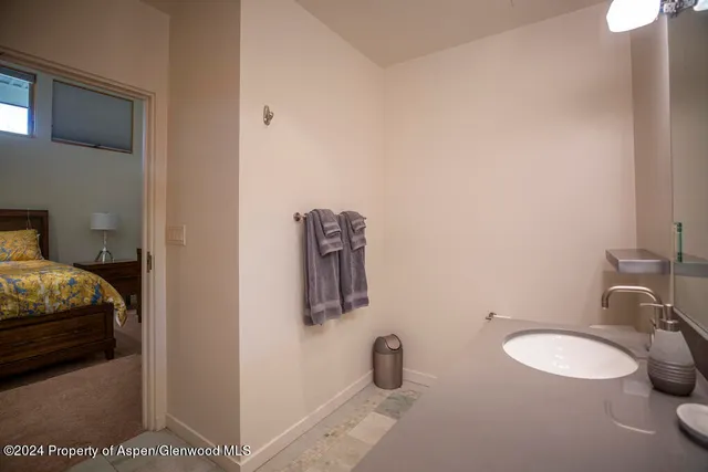 a bathroom with a sink and a mirror