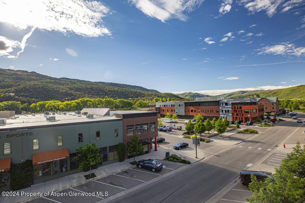 231 Robinson Street, Unit 330 Basalt, CO 81621 - Photo 32 of 45 a city view with tall buildings