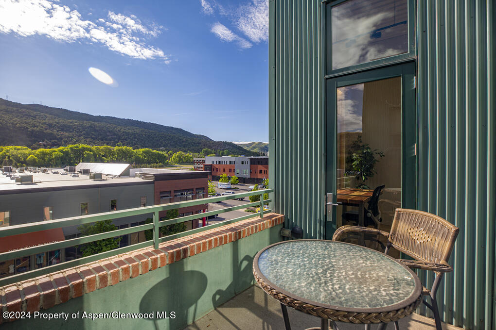 231 Robinson Street, Unit 330 Basalt, CO 81621 - Photo 37 of 45 a view of a balcony with chair and table