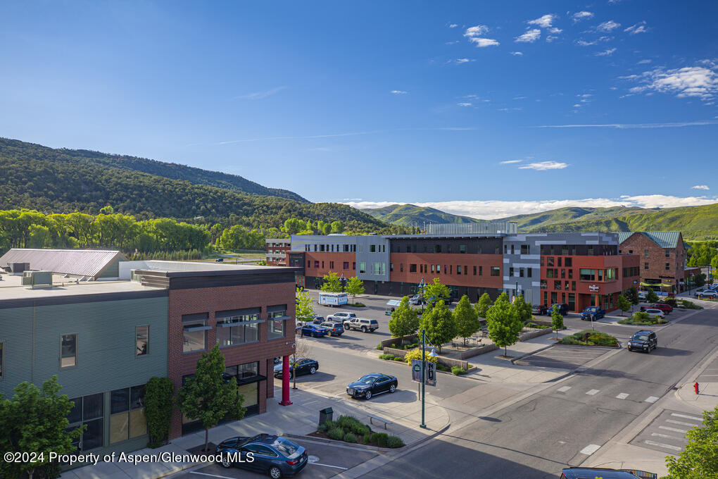 231 Robinson Street, Unit 330 Basalt, CO 81621 - Photo 44 of 45 a city view with tall buildings and a yard