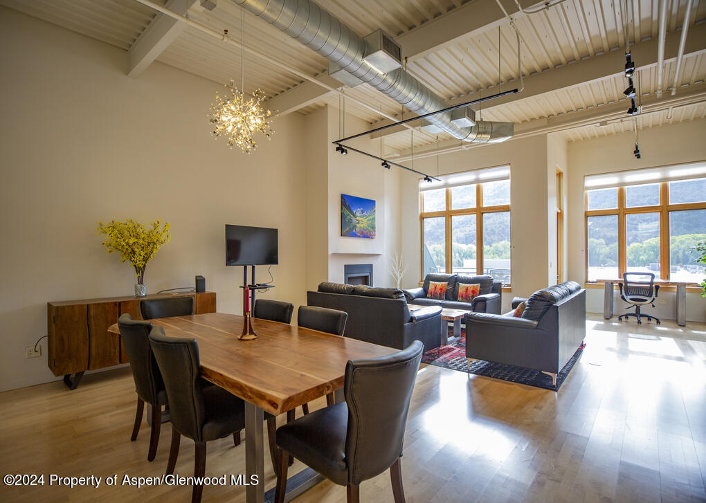 231 Robinson Street, Unit 330 Basalt, CO 81621 - Photo 7 of 45 a view of a dining room with furniture window and wooden floor