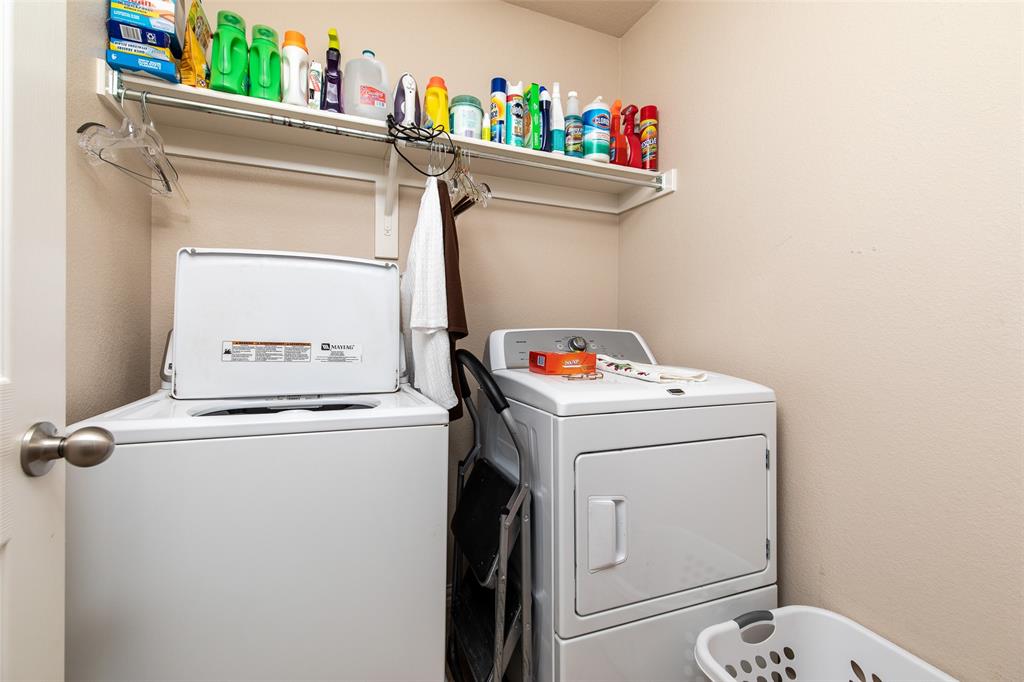 3118 Bedford Road Bedford, TX 76021 - Photo 27 of 29 Dedicated laundry area featuring a top-load washing machine and a front-load dryer