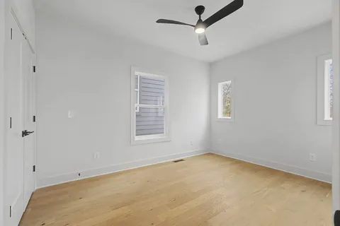 a view of empty room with ceiling fan