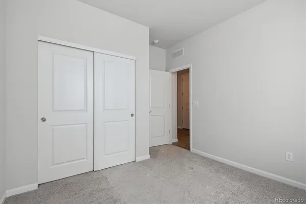 a bathroom with a sink toilet and a mirror