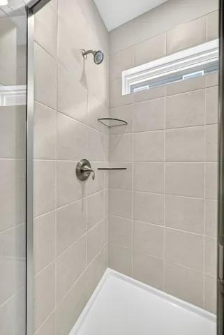 an aerial view of residential houses with outdoor space and parking