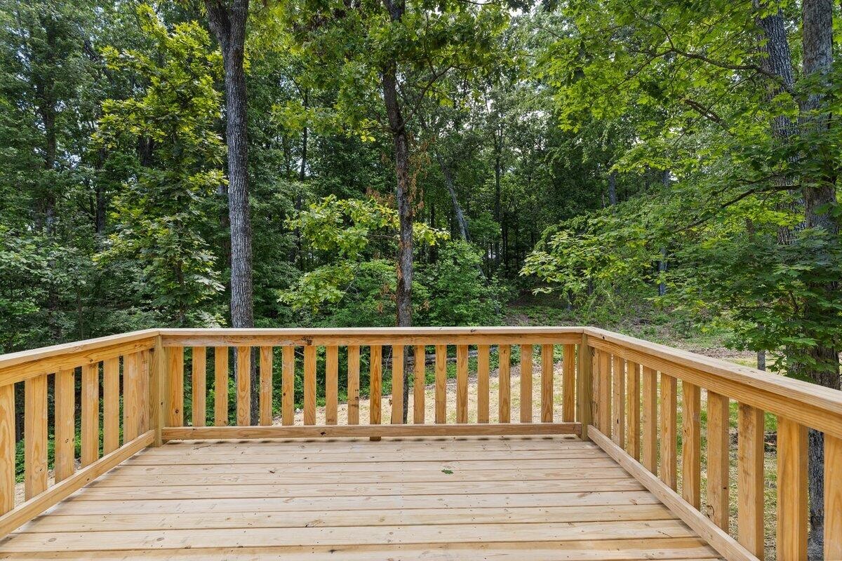 129 County Road 155 Riceville, TN 37370 - Photo 11 of 31 a view of a wooden roof deck