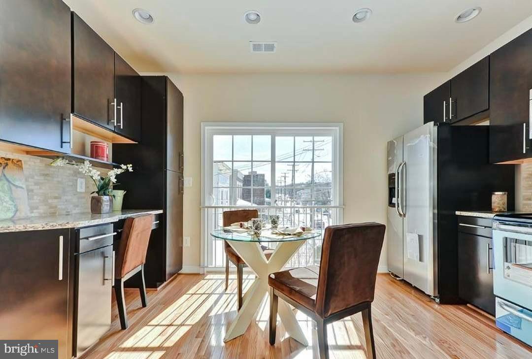 1406 22nd Street Southeast, Unit F Washington, DC 20020 - Photo 11 of 24 Bright and airy kitchen with modern finishes.