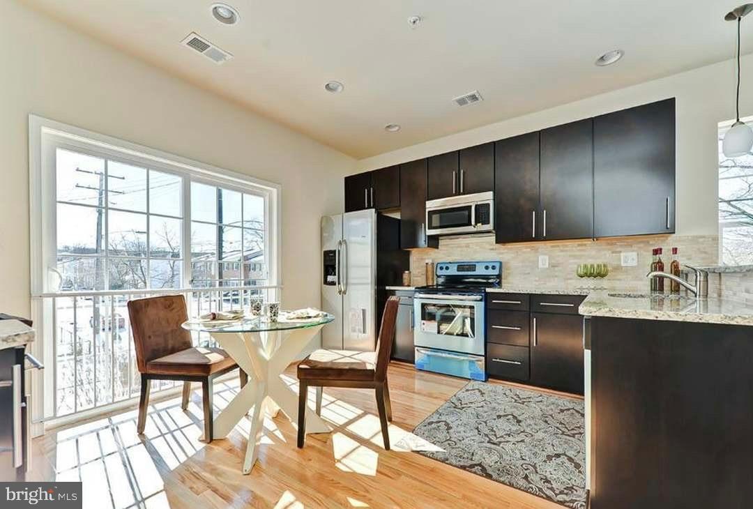 1406 22nd Street Southeast, Unit F Washington, DC 20020 - Photo 12 of 24 Bright and modern kitchen with natural light.