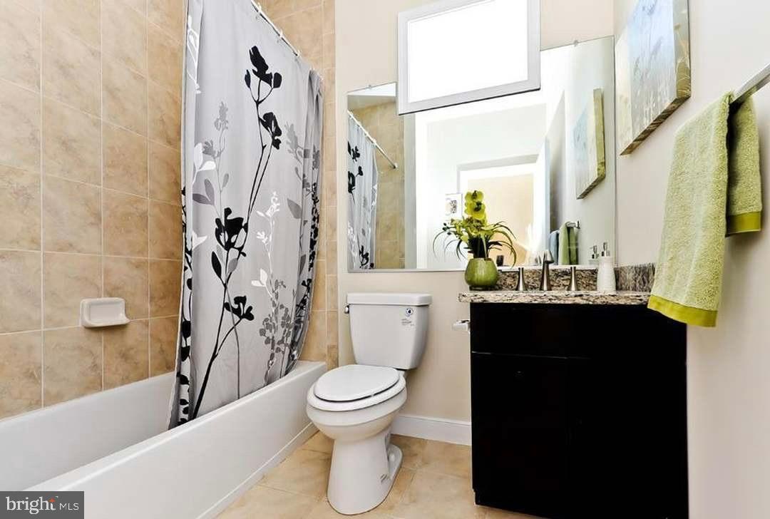 1406 22nd Street Southeast, Unit F Washington, DC 20020 - Photo 19 of 24 Modern bathroom with elegant floral accents.
