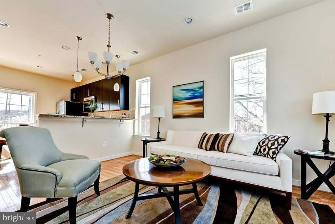1406 22nd Street Southeast, Unit F Washington, DC 20020 - Photo 2 of 24 Bright and airy living space with modern charm.