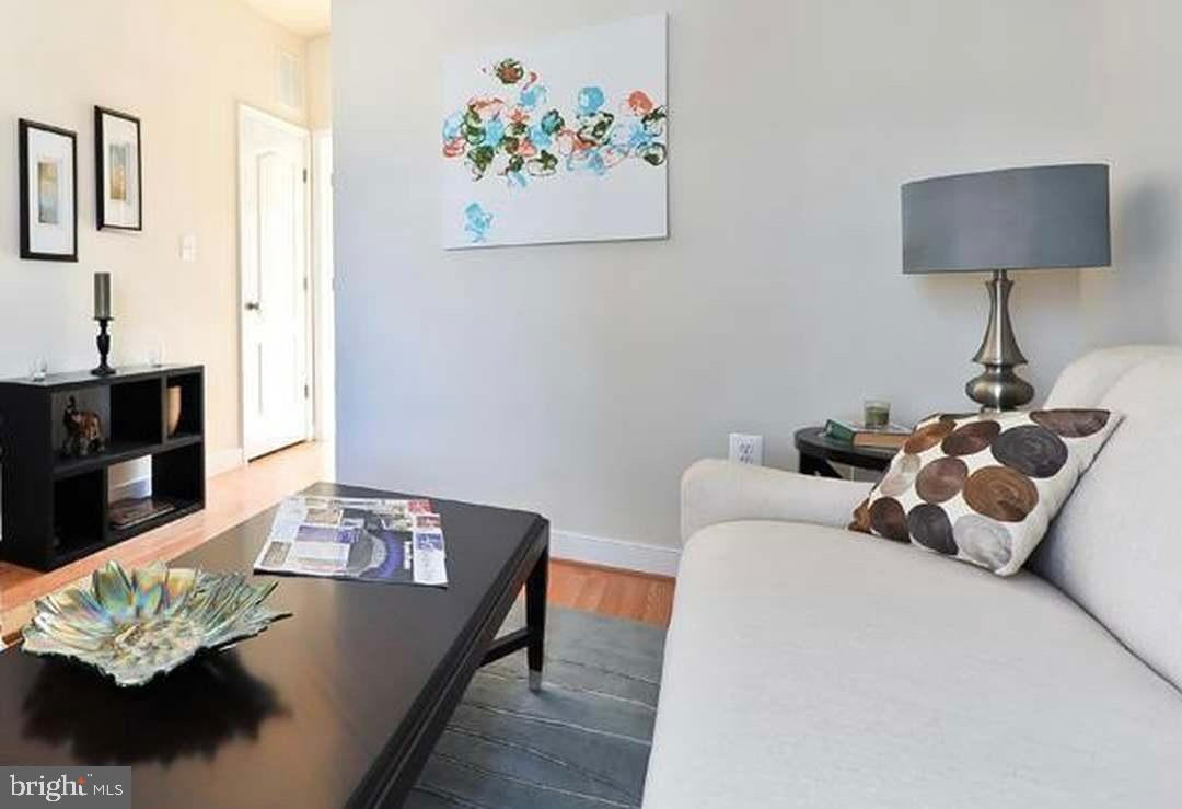1406 22nd Street Southeast, Unit F Washington, DC 20020 - Photo 6 of 24 Bright and inviting living space with art.