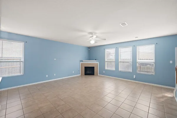 a view of empty room with windows