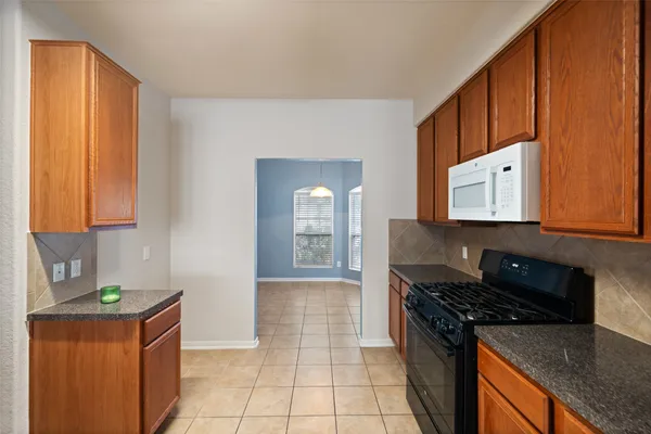 a view of a chandelier in big room and a mirror