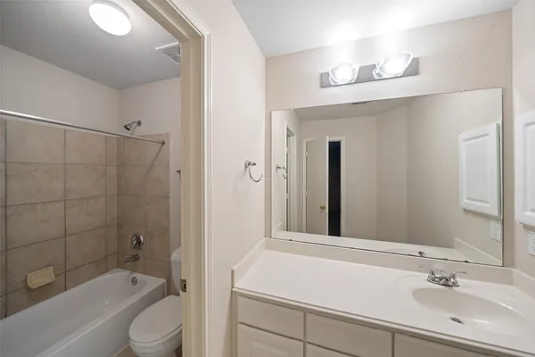 a view of a balcony with wooden floor and fence