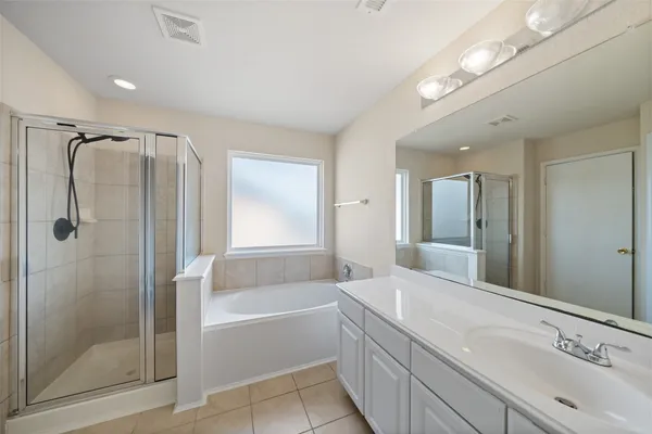 an aerial view of a house with a garden