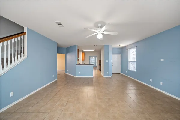 a kitchen with granite countertop wooden cabinets and a stove top oven