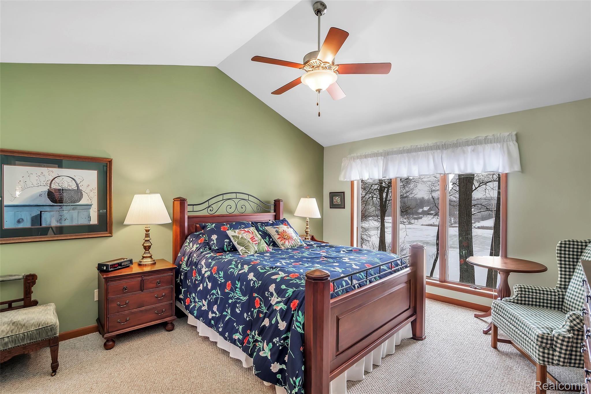 13413 White Lake Road Fenton, MI 48430 - Photo 10 of 27 Master Bedroom Suite with Cathedral Ceilings, Walk in Closets and views of Lake Sullivan.