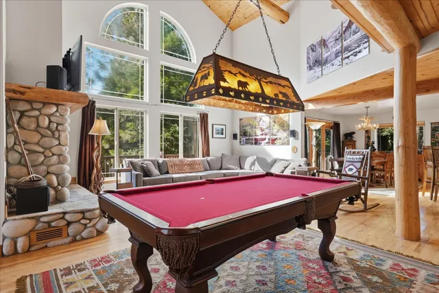a living room with furniture fireplace and flat screen tv