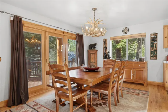 a dining room with furniture and wooden floor