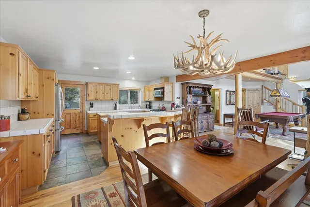 a kitchen with stainless steel appliances cabinets and a counter top space
