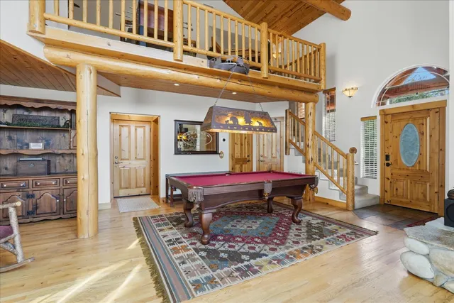 a bedroom with furniture and a chandelier