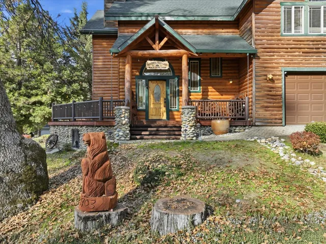a living room with a table tennis table and paintings on the wall