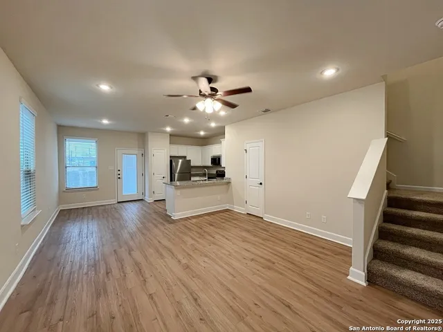 a view of kitchen with cabinets and wooden floor
