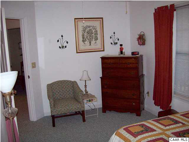 5619 Fredericksburg Road Ruckersville, VA 22968 - Photo 16 of 29 a living room with furniture and a mirror