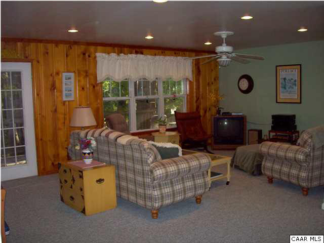 5619 Fredericksburg Road Ruckersville, VA 22968 - Photo 3 of 29 a living room with furniture and a large window