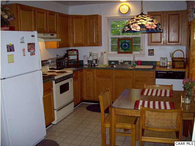 5619 Fredericksburg Road Ruckersville, VA 22968 - Photo 5 of 29 a kitchen with stainless steel appliances granite countertop a stove a sink dishwasher and a refrigerator with wooden floor