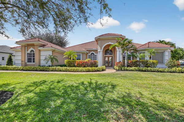 a front view of house with yard and green space