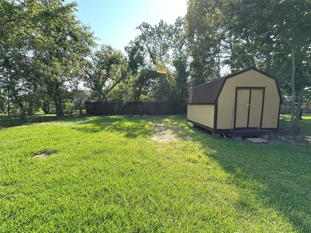 a view of a large garden with large trees
