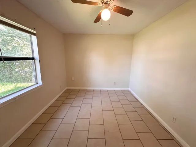 a view of an empty room and window