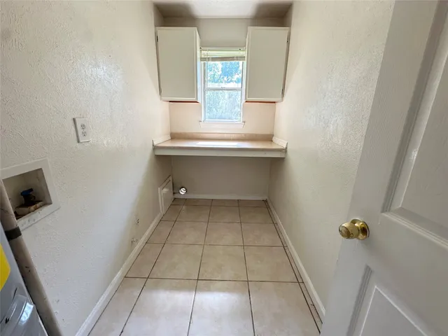 a view of an empty room with windows