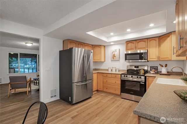 a bedroom with a bed and a potted plant