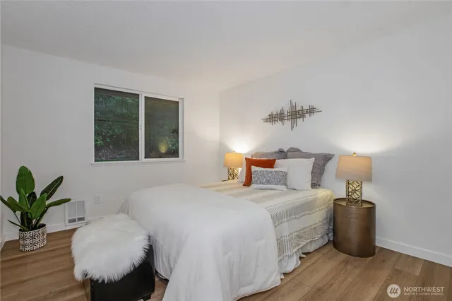 a bedroom with a bed and a couch