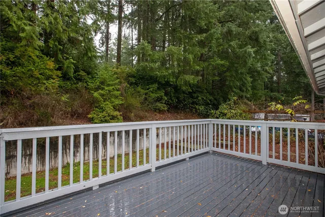 a view of backyard with parked area