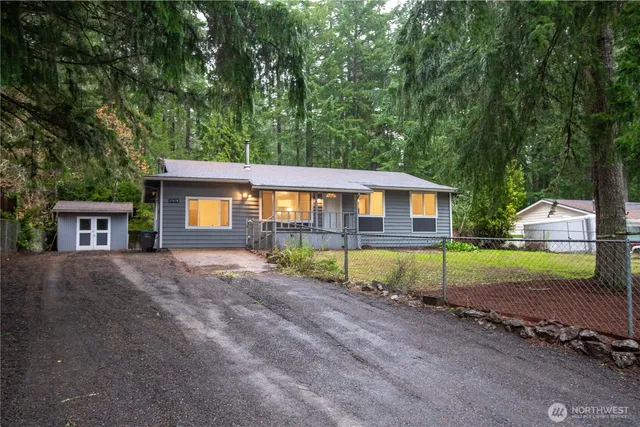 a backyard of a house with lots of green space