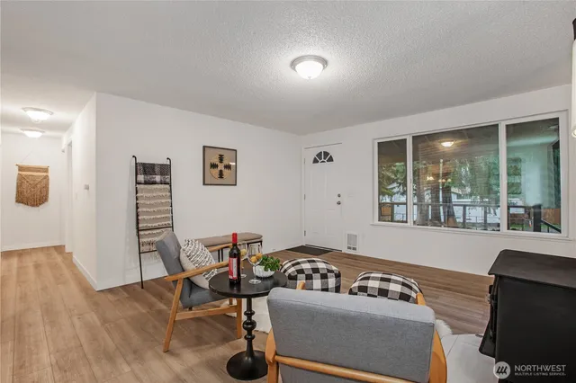 a kitchen with a sink stove top oven and cabinets