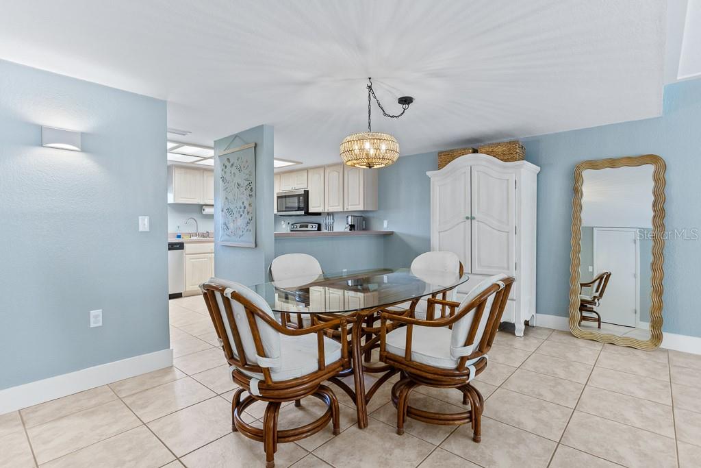 100 Ingrid Place Oldsmar, FL 34677 - Photo 15 of 51 a view of a dining room with furniture and chandelier