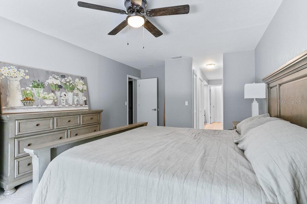 100 Ingrid Place Oldsmar, FL 34677 - Photo 17 of 51 a bedroom with a bed and a window