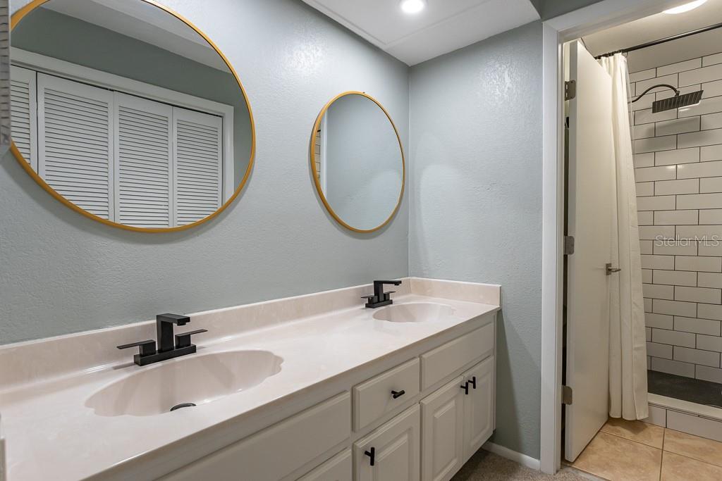 100 Ingrid Place Oldsmar, FL 34677 - Photo 20 of 51 a bathroom with a sink and a mirror