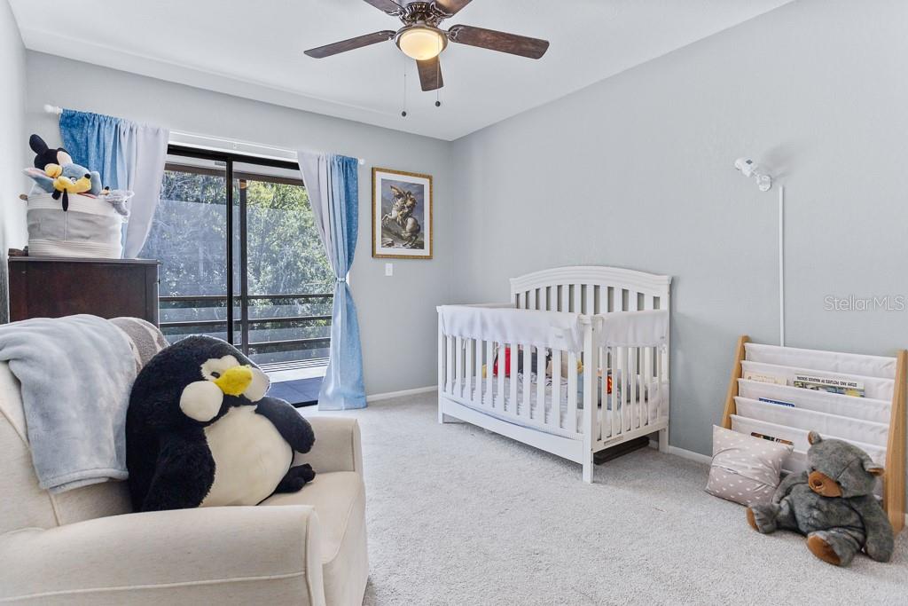 100 Ingrid Place Oldsmar, FL 34677 - Photo 24 of 51 a bedroom with furniture and window