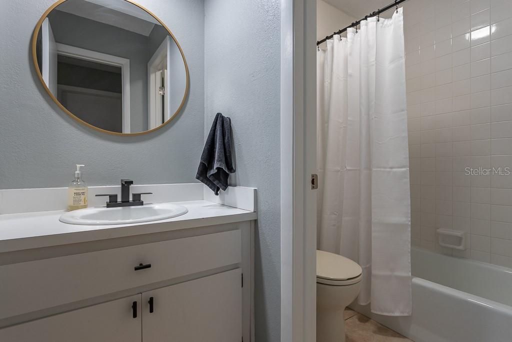 100 Ingrid Place Oldsmar, FL 34677 - Photo 26 of 51 a bathroom with a toilet sink and mirror